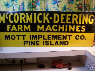Mccormick-deering tin advertising sign