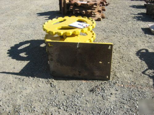 Yellow 22 inch compactor wheel trenchmaster backhoe