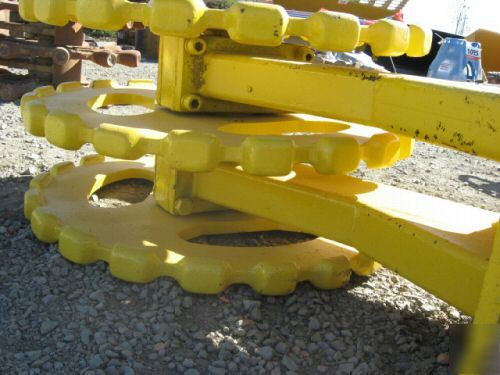 Yellow 22 inch compactor wheel trenchmaster backhoe