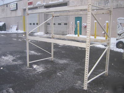 4 sections hd pallet racks , approx 32' l x 8' tall