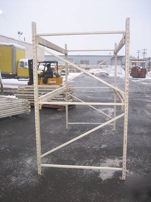 4 sections hd pallet racks , approx 32' l x 8' tall