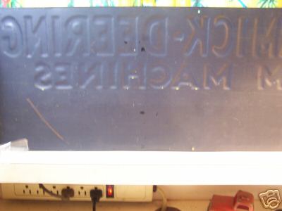 Mccormick-deering tin advertising sign