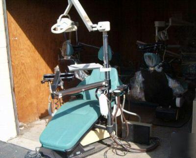 Dentist equipment + belmont chairs + dental assistant +