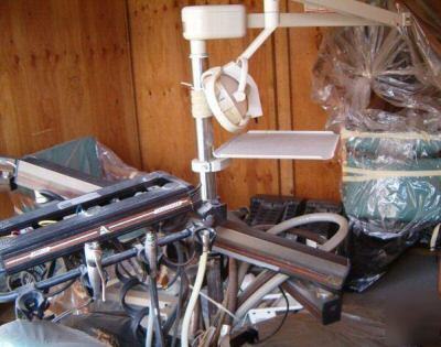 Dentist equipment + belmont chairs + dental assistant +