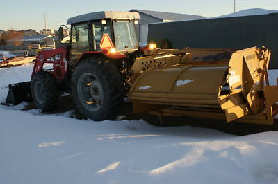 Bale buster for tractor. for large round bales