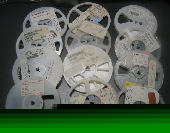 Lot of 12 reels of mixed quantity capacitors