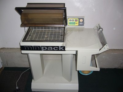 Mini pack miniplus shrink wrap machine. euc