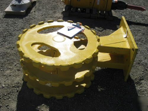 Yellow 22 inch compactor wheel trenchmaster backhoe