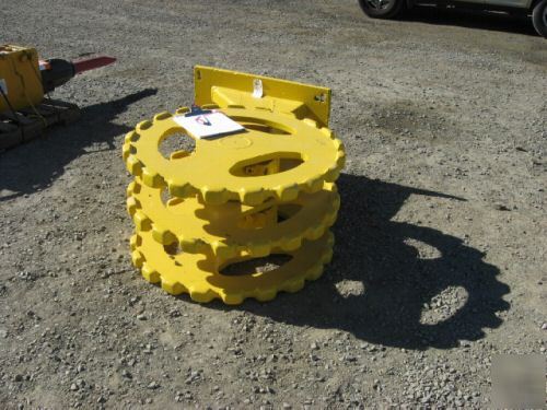 Yellow 22 inch compactor wheel trenchmaster backhoe