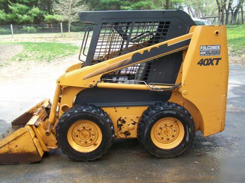 New 2002 case 40XT skid loader,900 hours, bucket, forks