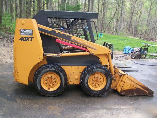 New 2002 case 40XT skid loader,900 hours, bucket, forks