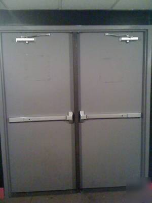 Commercial steel fire rated doors w/ panic hardware.