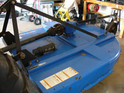 05 massey fergusion 1533 with 4 wd. & woods brush hog