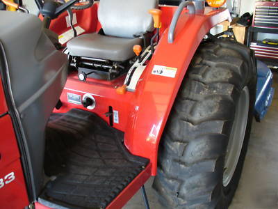 05 massey fergusion 1533 with 4 wd. & woods brush hog
