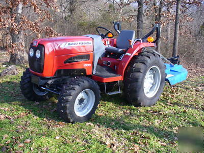05 massey fergusion 1533 with 4 wd. & woods brush hog