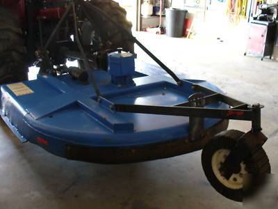 05 massey fergusion 1533 with 4 wd. & woods brush hog