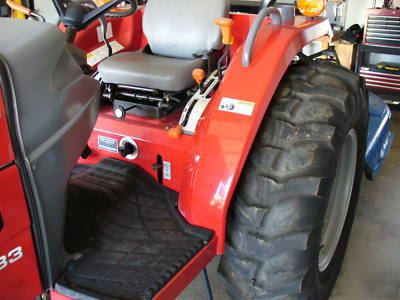 05 massey fergusion 1533 with 4 wd. & woods brush hog