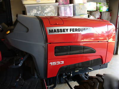 05 massey fergusion 1533 with 4 wd. & woods brush hog