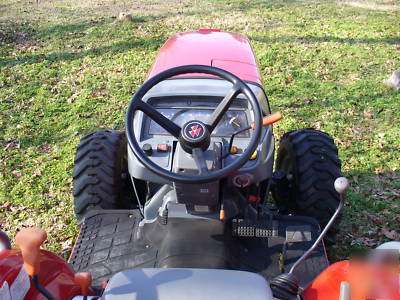 05 massey fergusion 1533 with 4 wd. & woods brush hog
