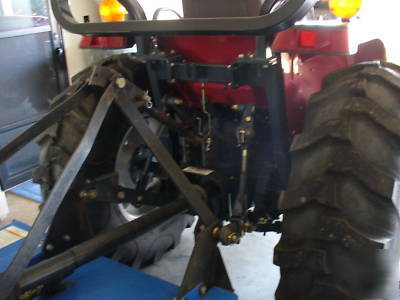 05 massey fergusion 1533 with 4 wd. & woods brush hog