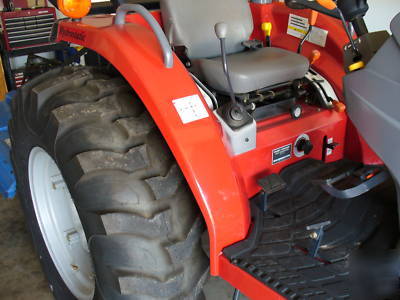 05 massey fergusion 1533 with 4 wd. & woods brush hog