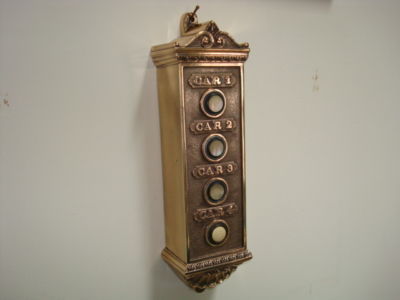 Antique brass elevator push buttons, restored