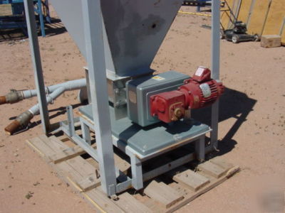 Bag dump station with acrison feeder.