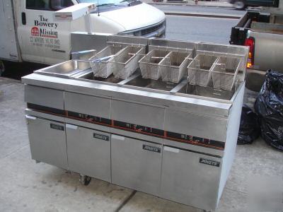 Three used anets deep fryers w/ work station & warmer