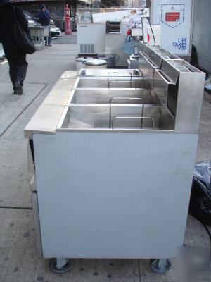 Three used anets deep fryers w/ work station & warmer