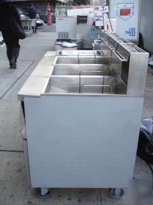 Three used anets deep fryers w/ work station & warmer