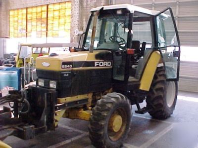 1994 ford 6640 tractor with push broom attachment