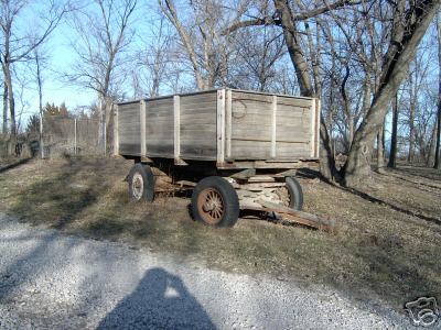 Antique farm trailer, wooden and vintage wheels, art
