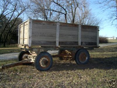 Antique farm trailer, wooden and vintage wheels, art